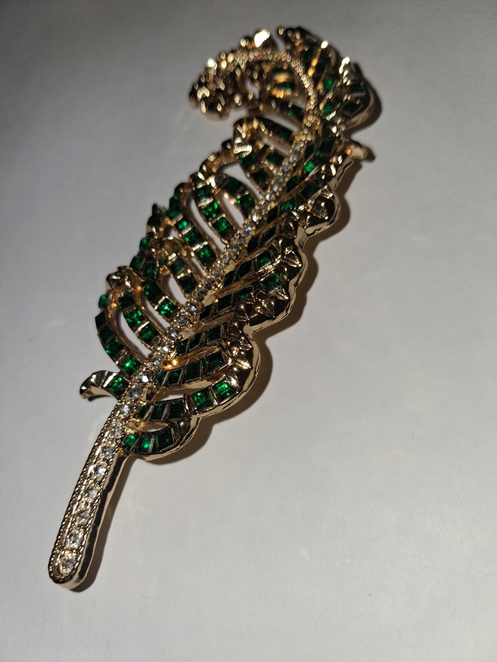 Gold-Tone Feather Brooch with Emerald-Green and Clear Stones